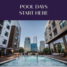 a pool in a courtyard between buildings