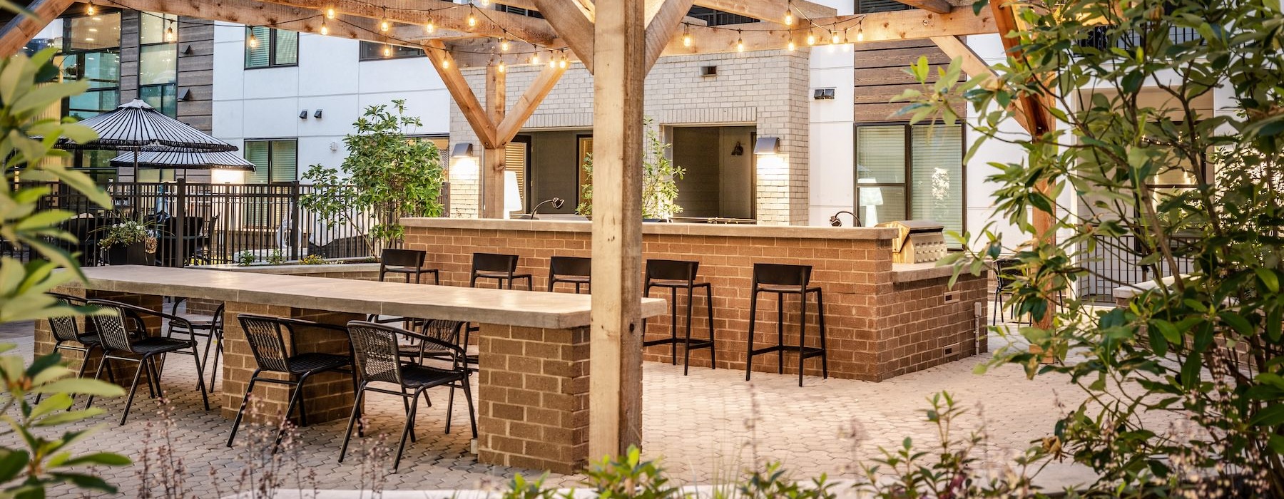 a patio with tables and chairs